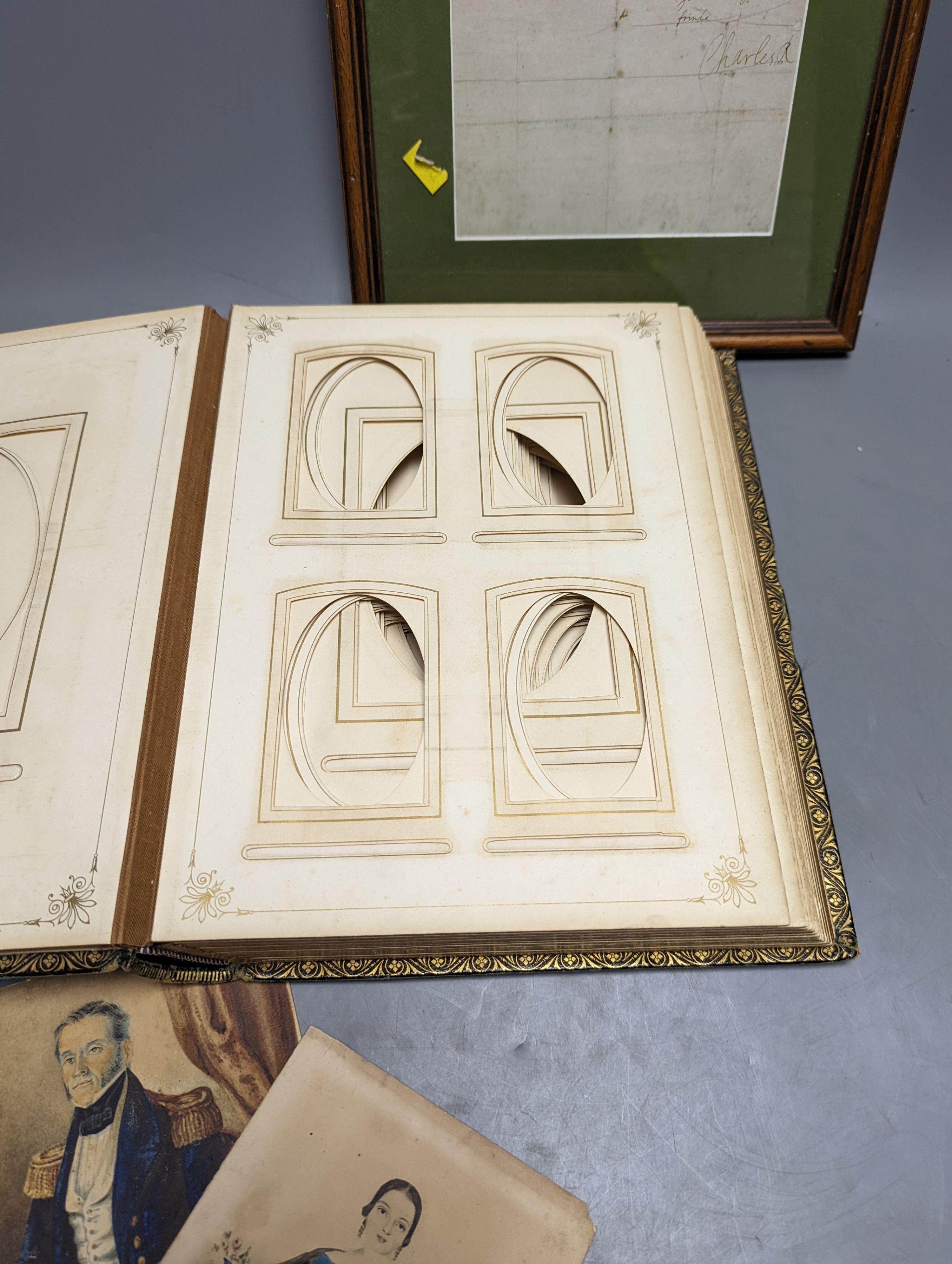 Two Victorian leather photograph albums, without contents, two Victorian portrait miniatures, ephemera, etc.